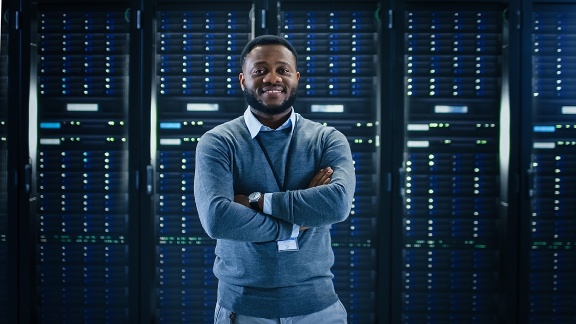 Bearded IT Engineer Standing and Posing with Crossed Arms